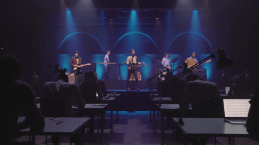 The Island Club performing to an oblivious crowd of office workers in new video, 'Paper Kiss'.